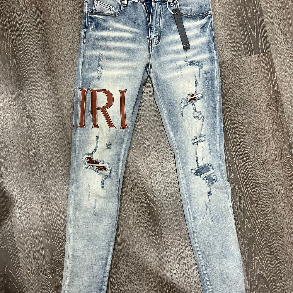 AMIRI Faded Blue Distressed Skinny Jeans